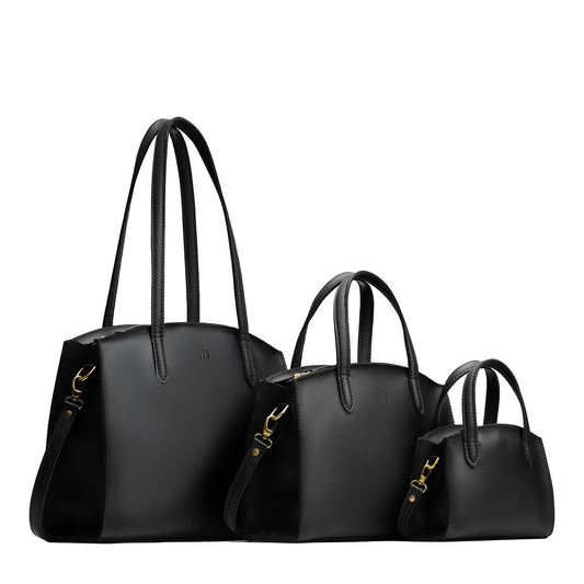 Black | Size comparison image of Mini, Medium, and Large-sized leather tote bags with handles, adjustable crossbody strap, zipper top, and back pockets