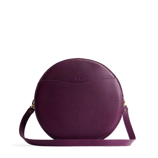 Plum | Large circle shaped leather bag with top zipper and carrying strap