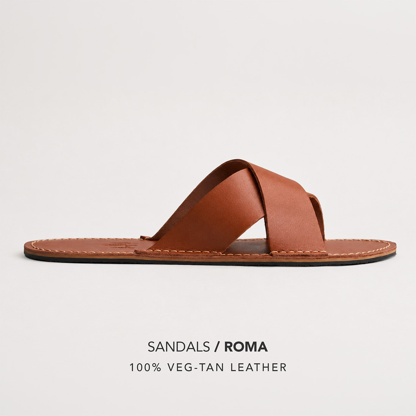 Miele | Flat leather sandal with debossed PLG three tree logo in sole, text reads "Sandals Roma 100% Veg Tan Leather"