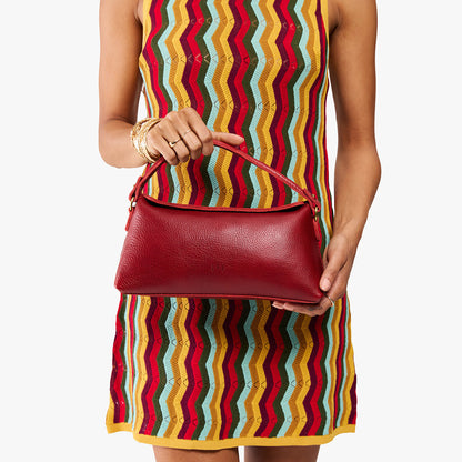 Chili Red | Model holding a red bowler style hand bag