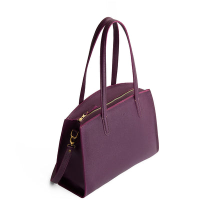Plum*Large | Leather tote bag with handles, adjustable crossbody strap, zipper top, and two back pockets