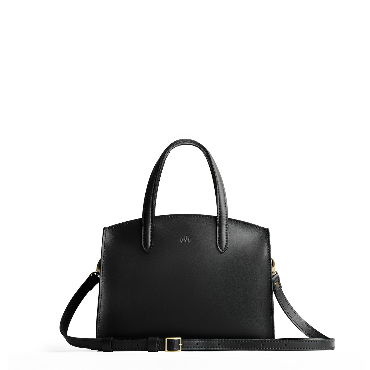 Black*Medium | Leather tote bag with handles, adjustable crossbody strap, zipper top, and two back pockets