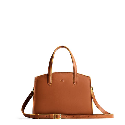 Honey*Medium | Leather tote bag with handles, adjustable crossbody strap, zipper top, and two back pockets