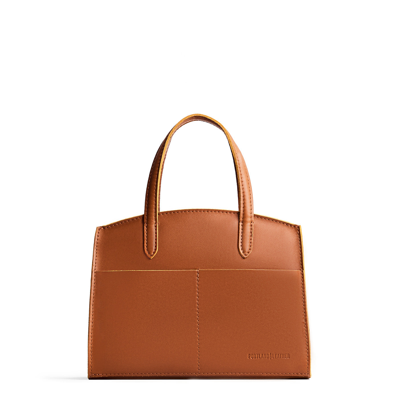 Honey*Medium | Leather tote bag with handles, adjustable crossbody strap, zipper top, and two back pockets