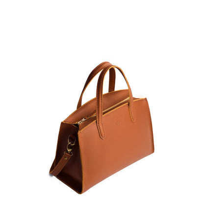 Honey*Medium | Leather tote bag with handles, adjustable crossbody strap, zipper top, and two back pockets