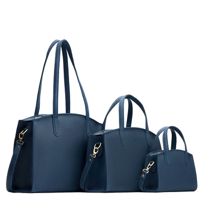Deep Water | Size comparison image of Mini, Medium, and Large-sized leather tote bags with handles, adjustable crossbody strap, zipper top, and back pockets