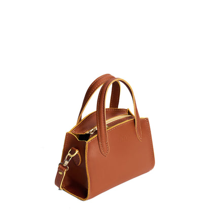 Honey*Mini | Leather tote bag with handles, adjustable crossbody strap, zipper top, and a back pocket