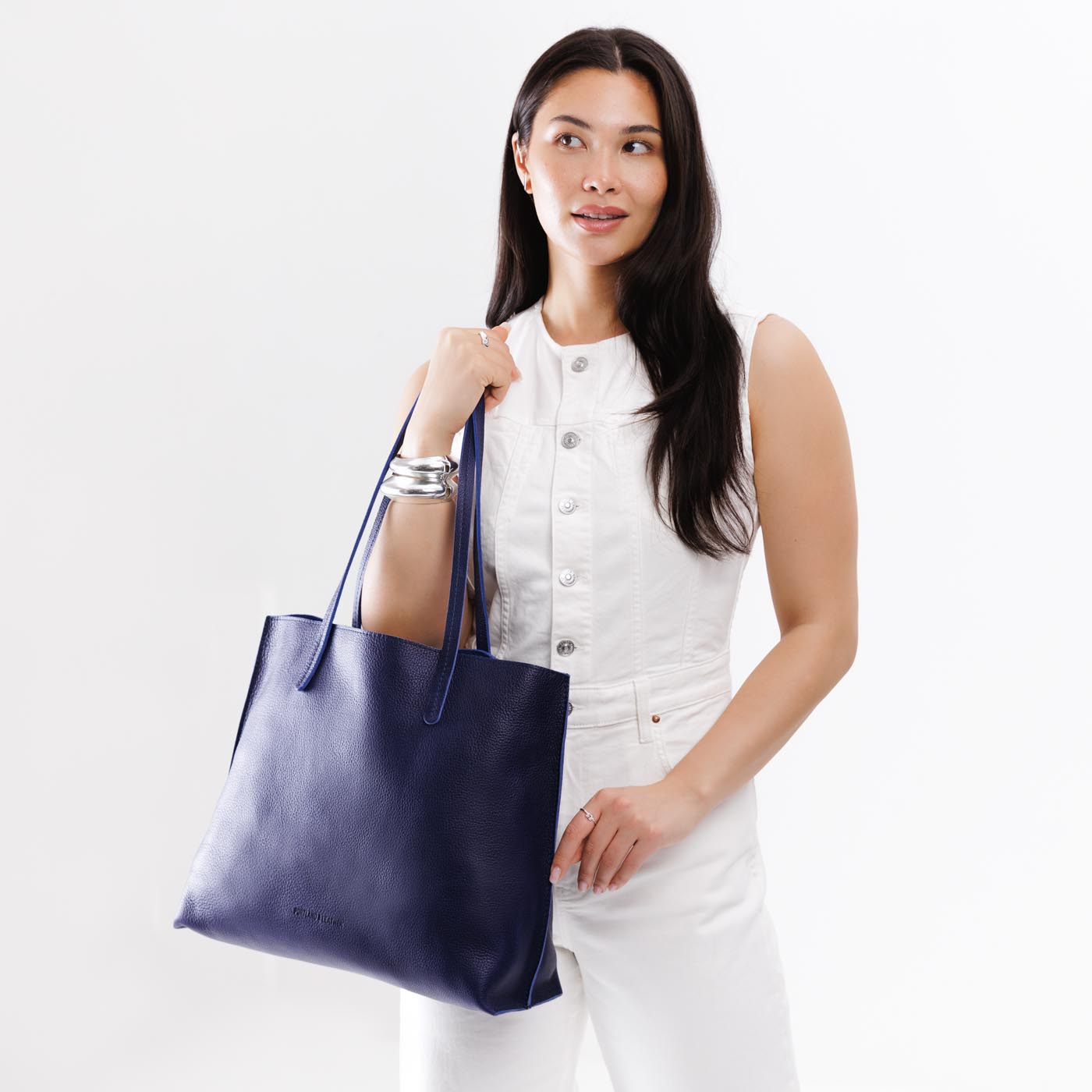 Cobalt*Large | Model holding leather tote bag with interior snap key loop