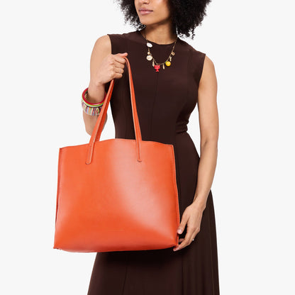 Koi*Large | Model holding leather tote bag with matching leather handles