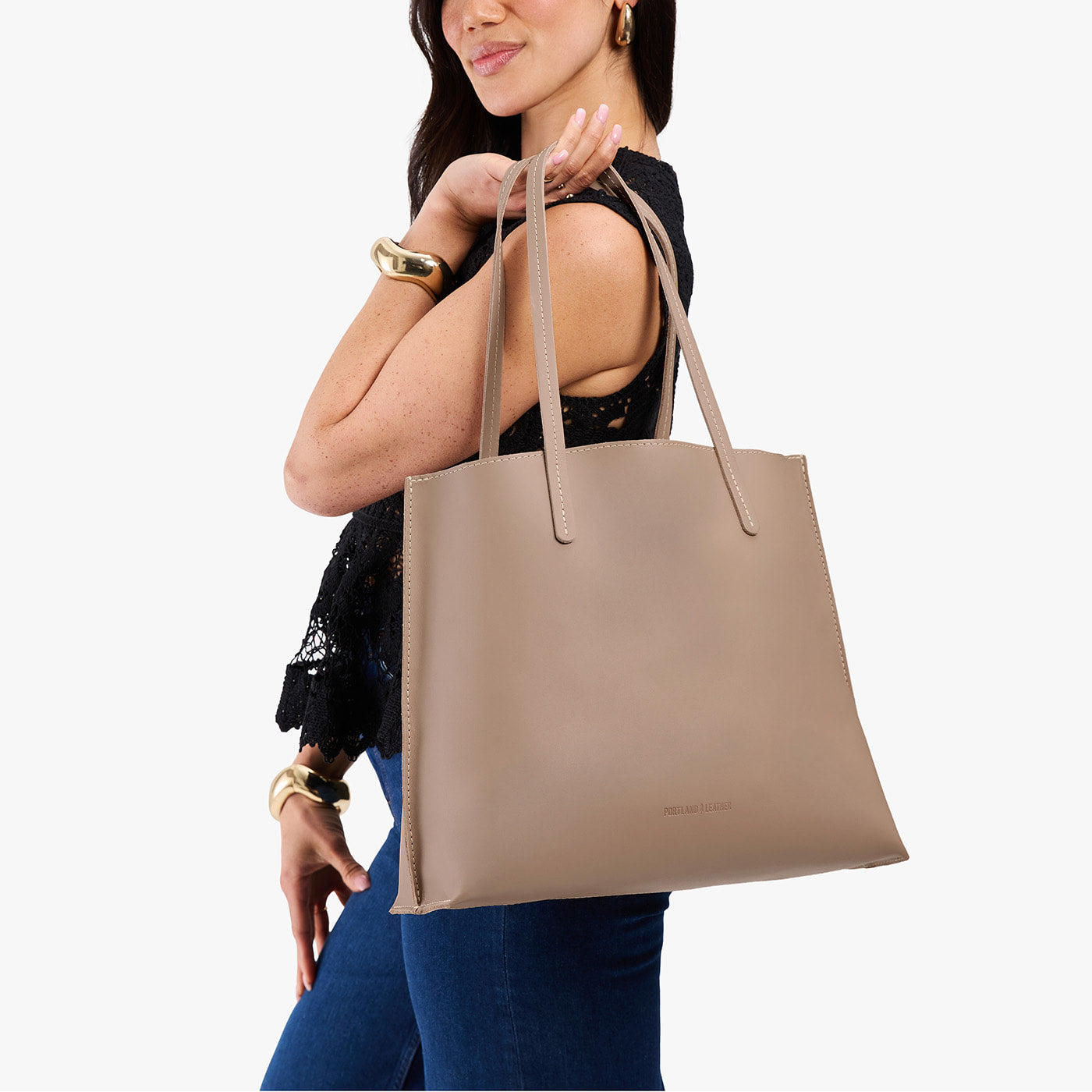 Stone*Large | Model carrying leather tote bag with matching leather handles
