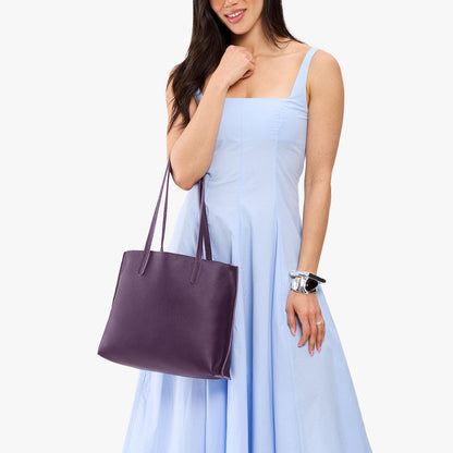 Empire*Medium | Model carrying leather tote bag with matching leather handles