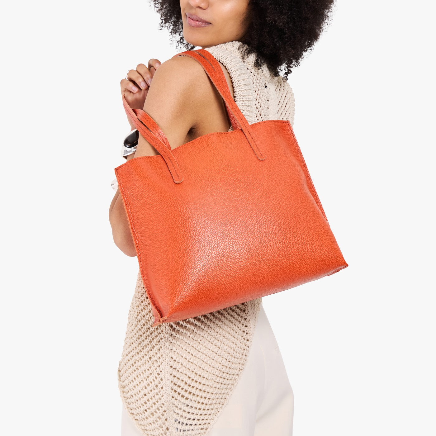 Koi*Medium | Model carrying leather tote bag with matching leather handles