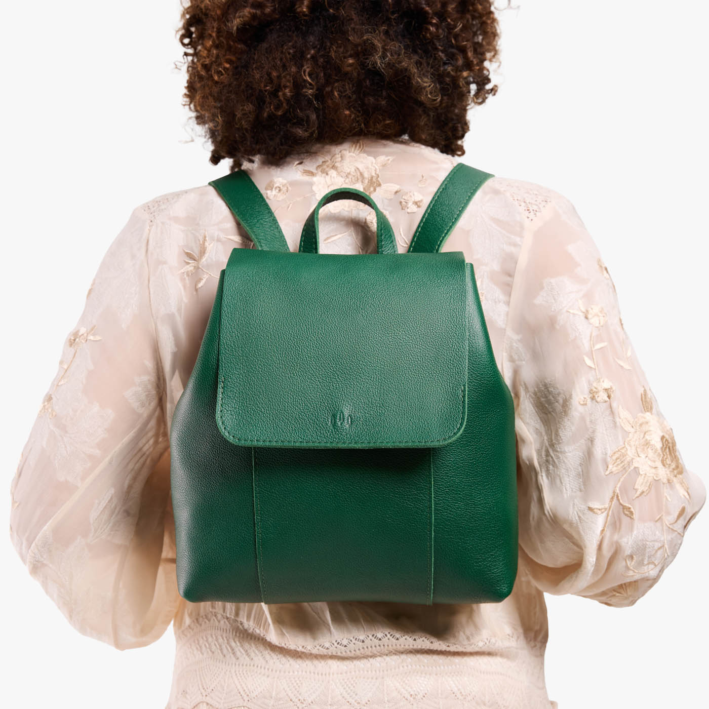 Bacalar | Model wearing a leather backpack on a white background