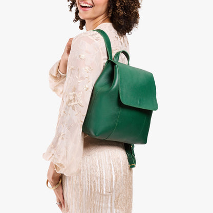 Bacalar | Model wearing a leather backpack on a white background