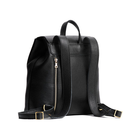 Pebbled--black | Leather backpack with magnetic flap closure on a white
