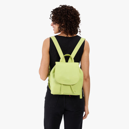 Shadow Lime | Pebbled leather drawstring backpack being worn by a person