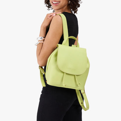 Shadow Lime | Pebbled leather drawstring backpack being worn by a person
