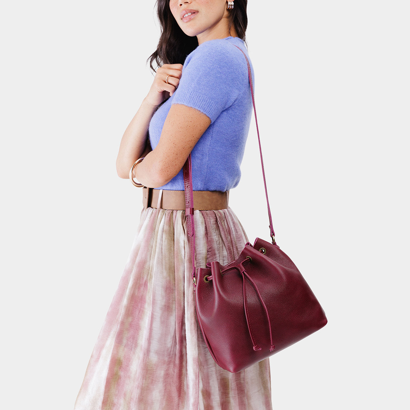 Orchid*Large | Model wearing slouchy crossbody bag with drawstring closure