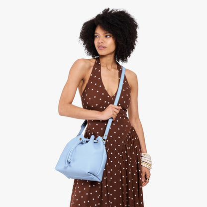 Skyway*Large | Model wearing slouchy crossbody bag with drawstring closure