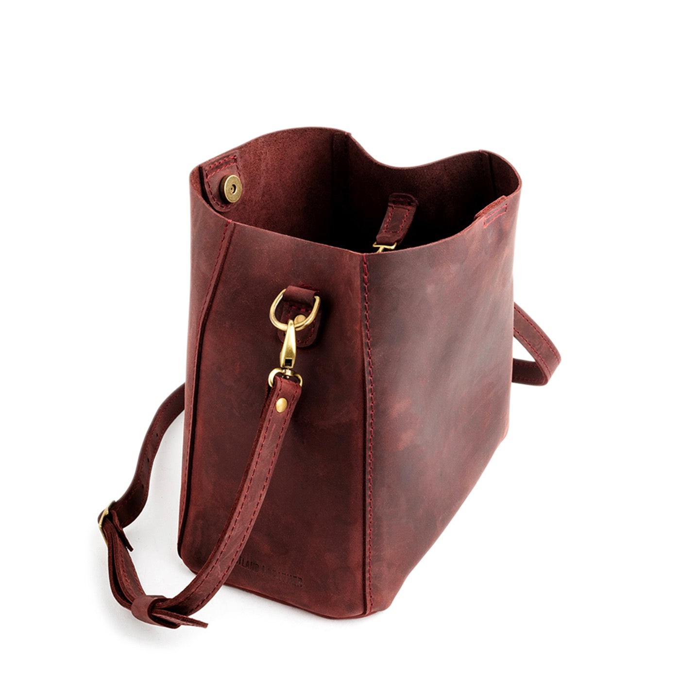 Merlot | symmetrical bucket bag with latch closure and removable crossbody strap