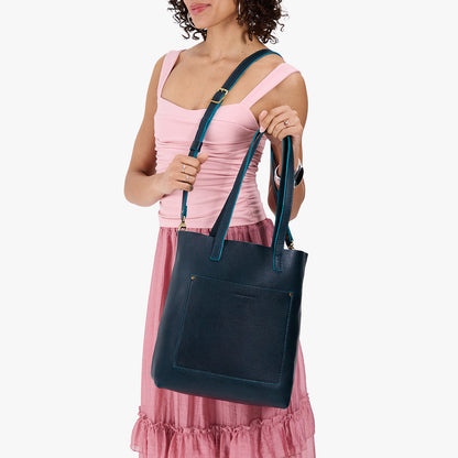 Boreal*Classic | Model holding medium Tote with dual shoulder straps and crossbody strap
