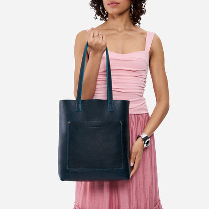 Boreal*Classic | Model holding medium Tote with dual shoulder straps and crossbody strap