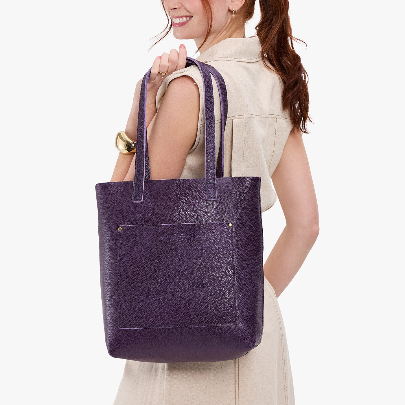 Empire*Classic | Model holding medium Tote with dual shoulder straps and crossbody strap