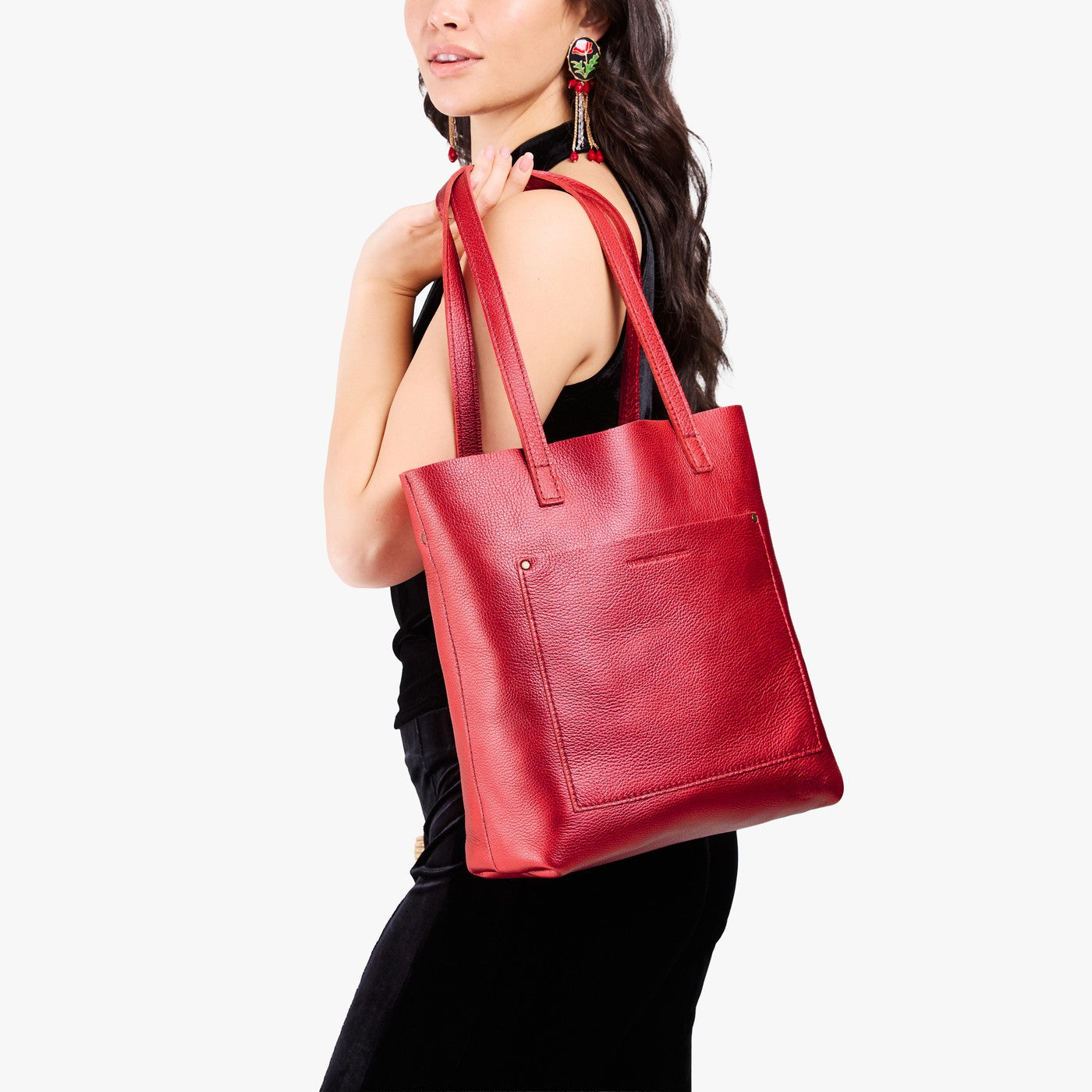 Reba Red*Classic | Model holding medium Tote with dual shoulder straps and crossbody strap