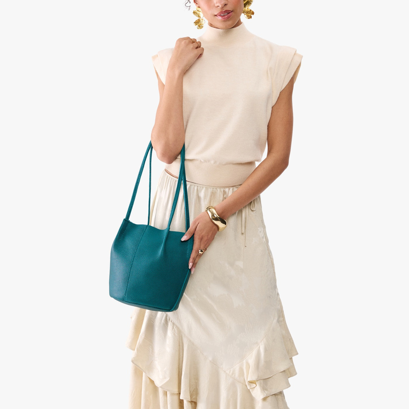 Aquarius*Small | Model wearing matching white shirt and skirt carrying petite bucket shaped tote bag with matching leather handles