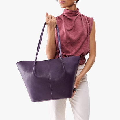 Empire*Oversized | Model holding extra wide bucket shaped tote bag with matching leather handles