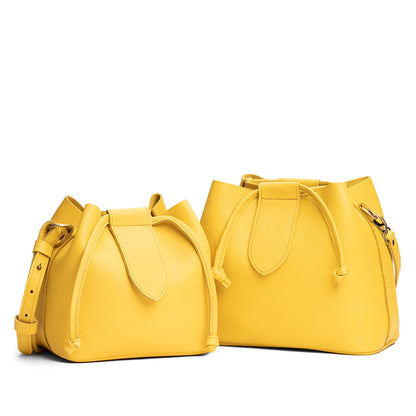 Canary | Small and large symmetrical leather bags with leather drawstring closure and adjustable shoulder strap