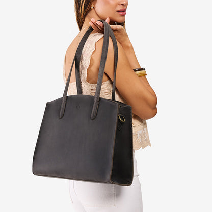Full Moon*Large | Model carrying leather tote bag with handles, adjustable crossbody strap, and two back pockets