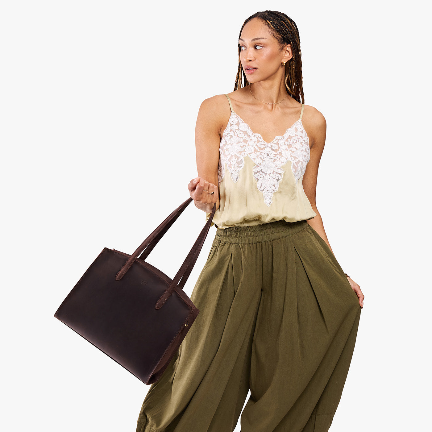 Moose*Large | Model carrying leather tote bag with handles, adjustable crossbody strap, and two back pockets