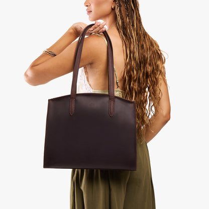 Moose*Large | Model carrying leather tote bag with handles, adjustable crossbody strap, and two back pockets