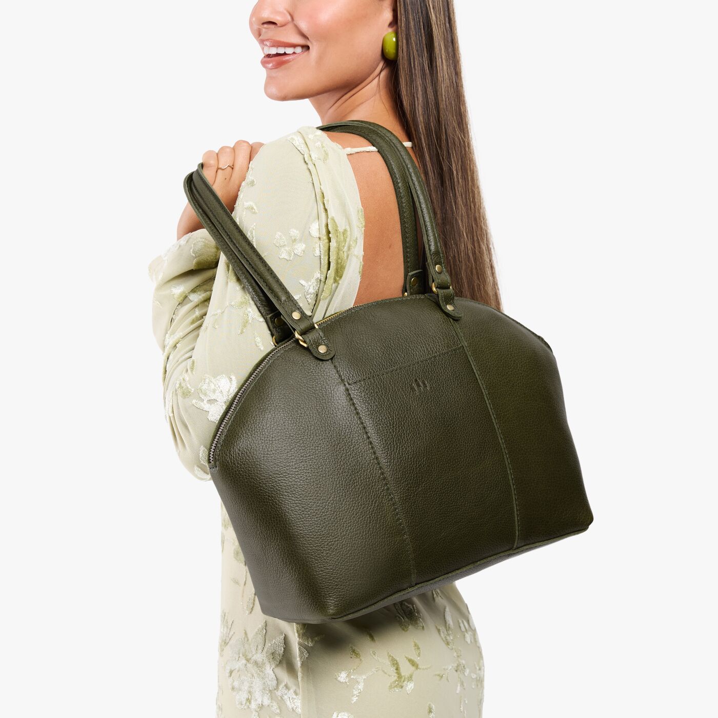 Pebbled Olive*Large | Model holding a half circle crossbody bag with handles and removable crossbody strap