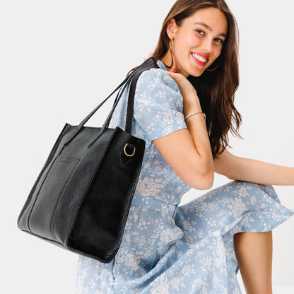 Pebbled--black*North/South | Structured large tote bag with overlapping panels and crossbody strap