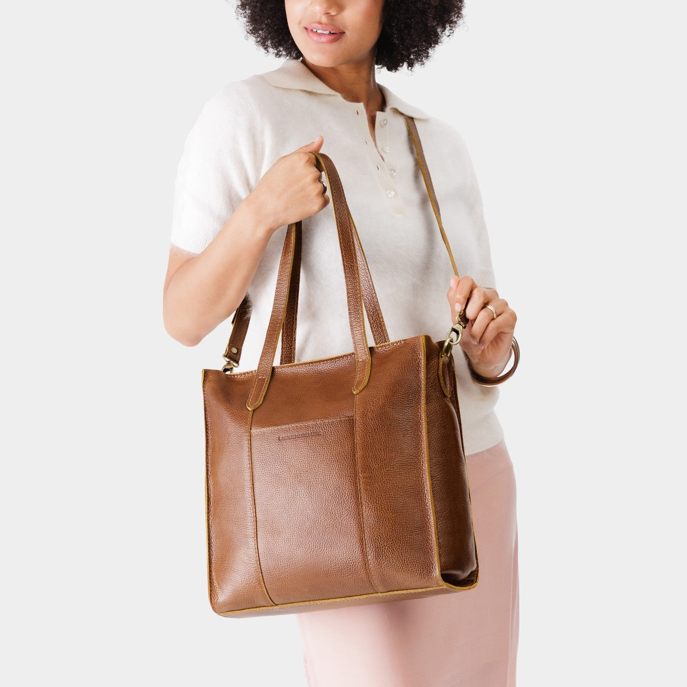 Asheville*North/South | Model wearing structured large tote bag with overlapping panels and crossbody strap