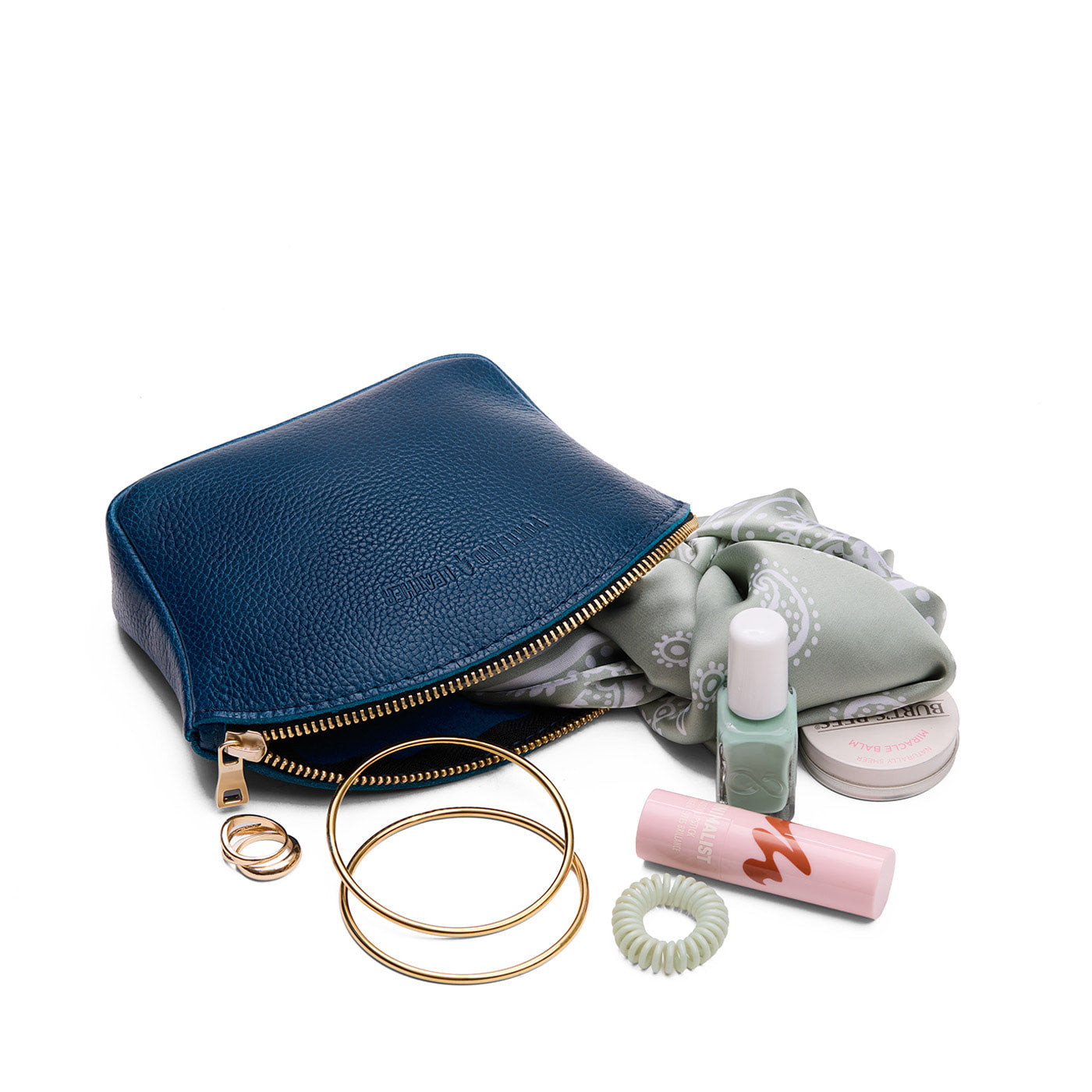 Caspian*Large | Seashell shaped leather makeup bag with curved top zipper and flat bottom