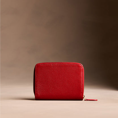 Icon Red | Wallet with card and storage pockets on a light brown background - back view