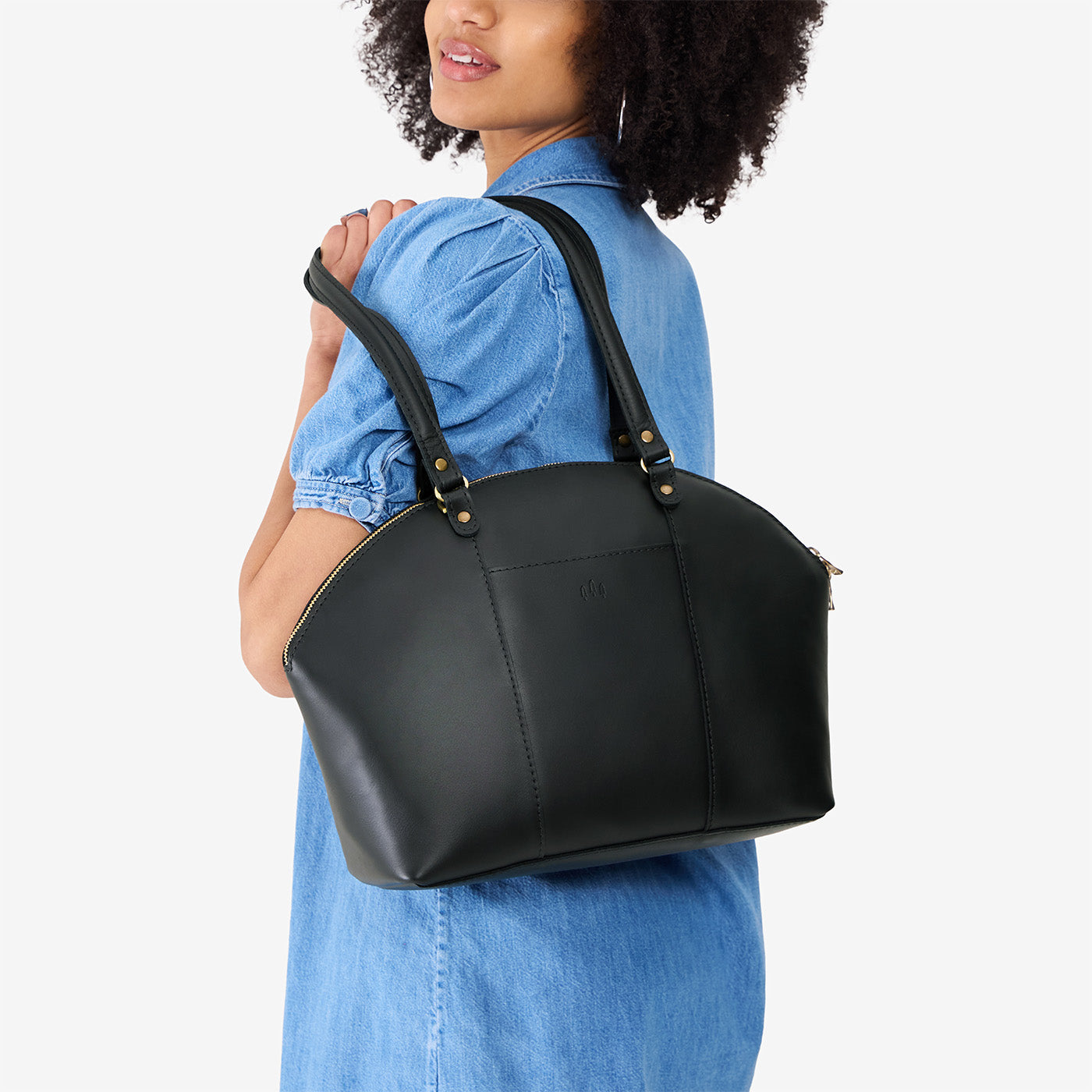 Black*Large | Model holding a half circle crossbody bag with handles and removable crossbody strap
