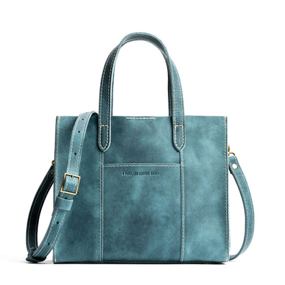 Aqua | Structured mid-size tote bag with overlapping panels and crossbody strap