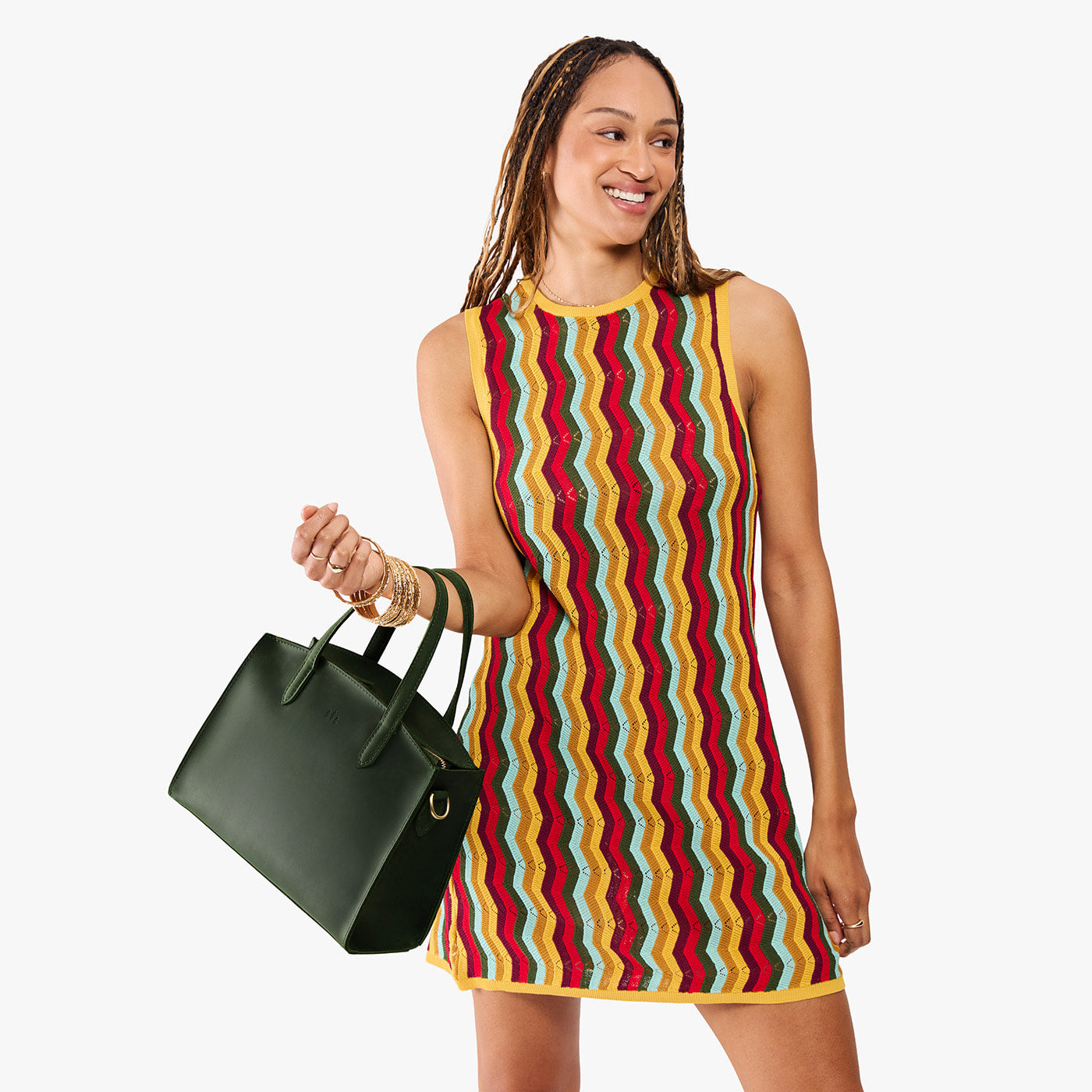 Evergreen*Medium | Model carrying leather tote bag with handles, adjustable crossbody strap, and two back pockets