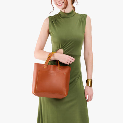 Sienna*Classic | Model holding midsize crossbody tote with handles and a pocket