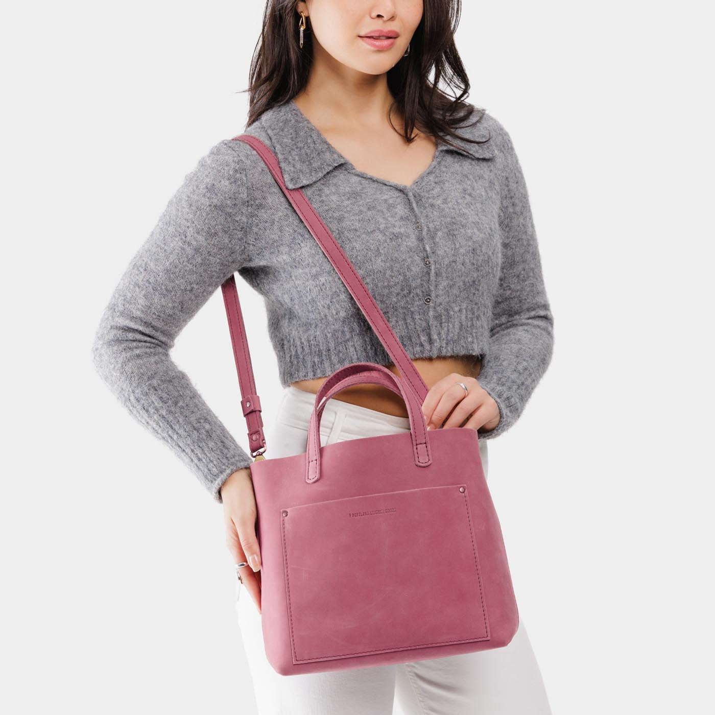 Foxglove | Model wearing midsize crossbody tote with handles and a pocket
