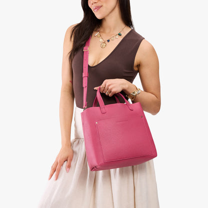 Wild Rose*Classic | Model holding midsize crossbody tote with handles and a pocket