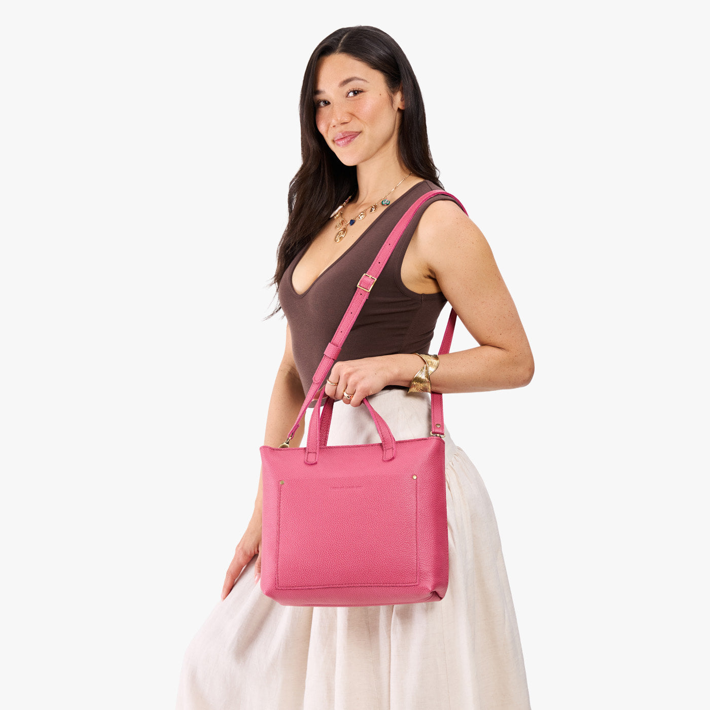 Wild Rose*Zipper | Model holding midsize crossbody tote with handles and a pocket