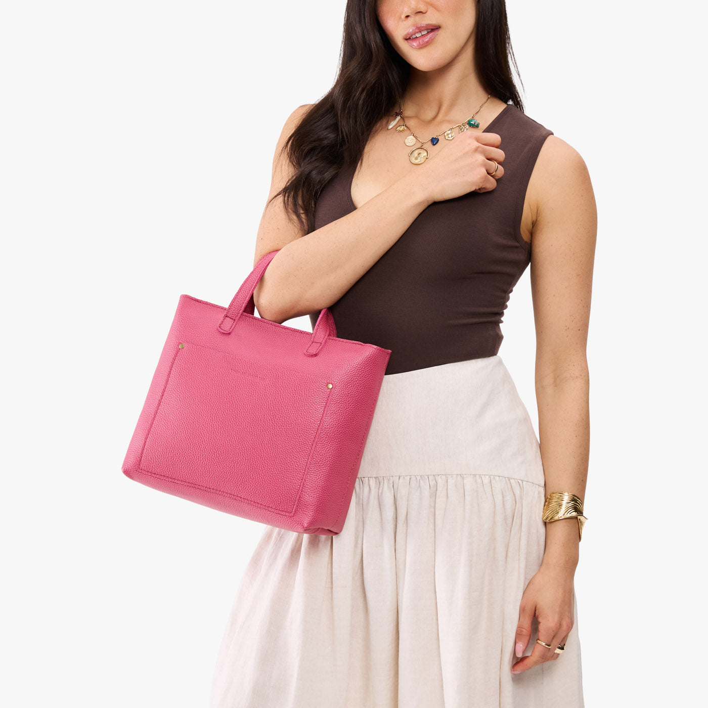 Wild Rose*Zipper | Model holding midsize crossbody tote with handles and a pocket