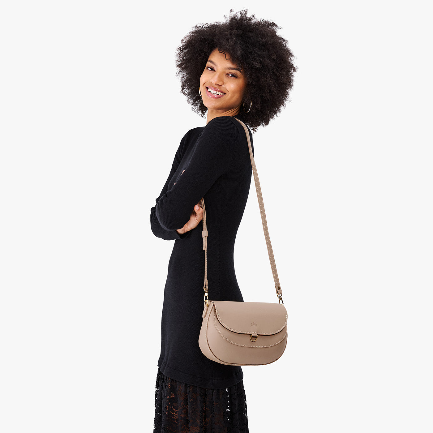 Stone*Large | Model wearing a leather Crossbody with a flap and magnetic closure