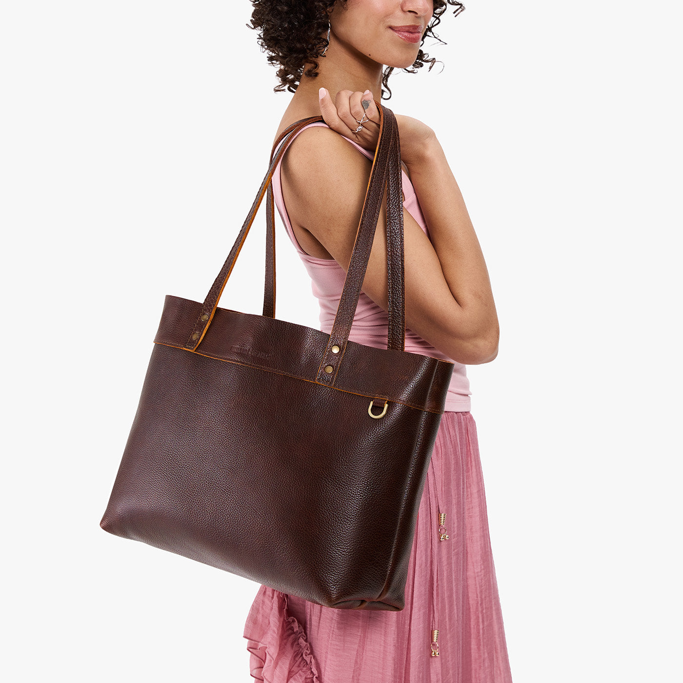 Coldbrew*Large*Classic | Model wearing leather tote bag with riveted straps and exterior key loop
