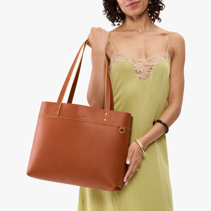 Honey*Large*Classic | Model wearing leather tote bag with riveted straps and exterior key loop